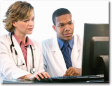 Medical professionals in front of computer
